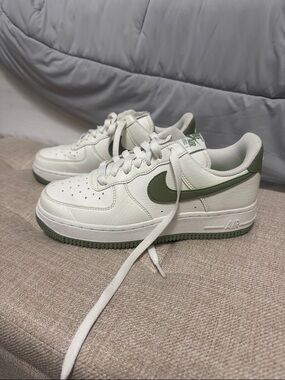Nike White Low-Top Sneakers with Olive Green Swoosh